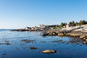 Scenic rocky coastline near Sjobadet Myklebust public swimming nature pool, Tananger, Norway, May 2018