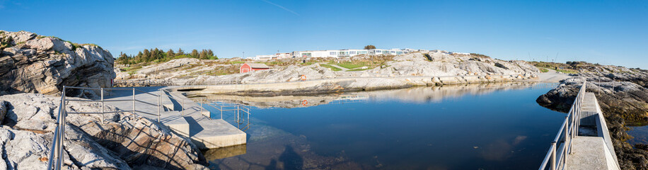 Panorama of Sjobadet Myklebust public natural swimming area and nearby private houses, Tananger, Norway, May 2018