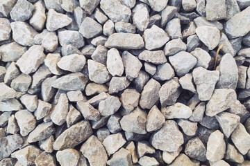 Small gravel road. Pebble background. Crushed stone texture. Gravel rock closeup