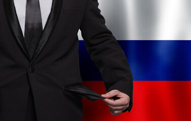 Russian poverty, financial difficulties, bad economy and social problem concept. Businessman with empty pockets against flag of Russia background.