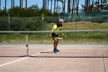 Tennis player performing a drop shot