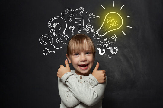 Child girl school student with yellow lightbulb. Kid ideas and development concept