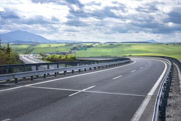 The bend road on the viaduct over the highway.