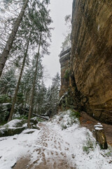 Fototapeta na wymiar snowy hiking path at the Elbsandsteingebirge (Saxon Switzerland, Germany)