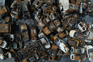 A lot of rusty burnt cars in Irpen, after being shot by the Russian military.