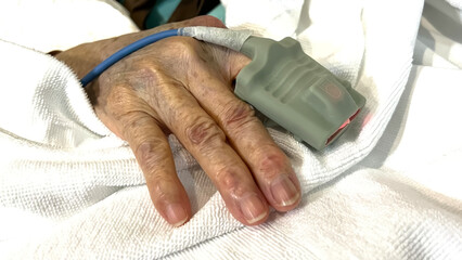 Pulse oximeter attached to patient's finger