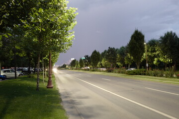 empty road lanes city dusk storm