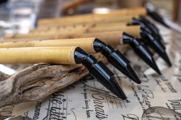 Woodwind musical instrument, handmade wooden saxophone, workshop.