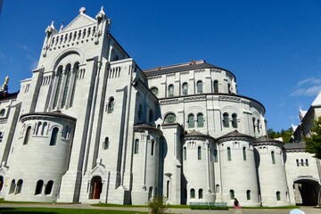 Fototapeta premium Basilica of Sainte-Anne-de-Beaupré church in Quebec Canada under clean blue sky in summer