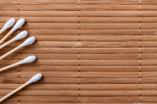 wooden cotton buds on a mat