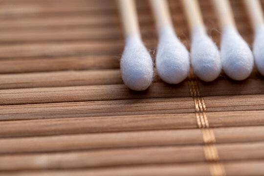 wooden cotton buds on a mat