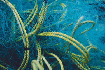 Detail view and background of used fishing nets - obrazy, fototapety, plakaty