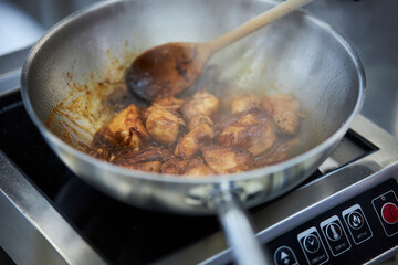 cooking noodles with chicken and teriyaki sauce. cooking
