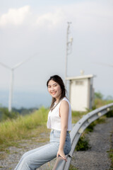 cute girl standing and playing with beautiful nature with clear sky on vacation They stood and took pictures happily.