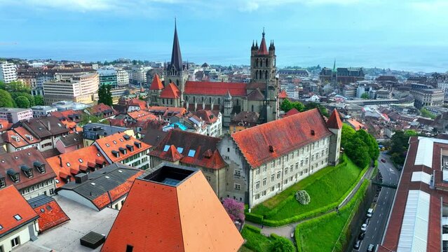 aerial view of Lausanne, Switzerland, flying around historical city centre of Lausanne on Geneva lake, Lausanne gothic protestant cathedral
