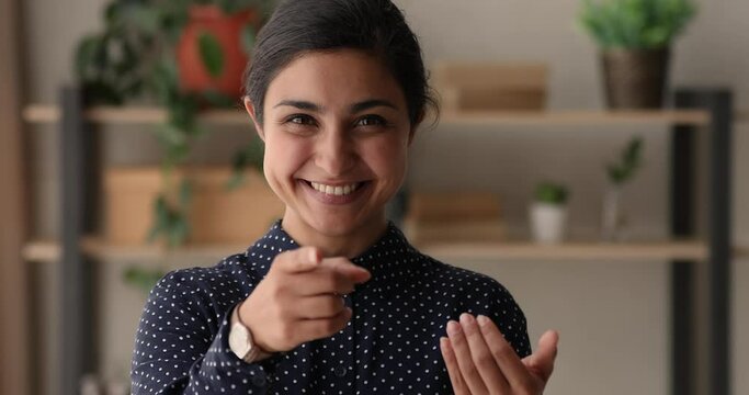 Head shot portrait Indian female HR manager choosing candidate for job position, welcoming vacancy candidature applicant pointing finger at camera, makes come here beckoning gesture. Hiring concept