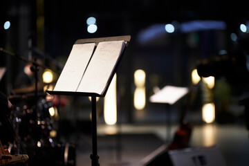 music stand with musical score on a blurred background. musical score on a music stand, close-up 