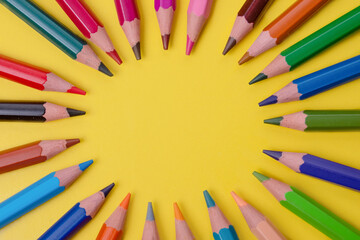 a few colored pencils on a yellow-blue background Develop creativity Get creative