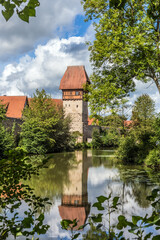 Fototapeta na wymiar Dinkelsbühl, Germany. Scenic view of medieval fortifications on the banks of the river Wörnitz