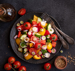 Fresh vegetables salad with tomatoes, peppers, cucumbers and other ingredients, healthy eating