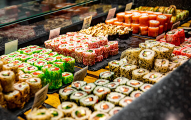 Pile of sushi on supermarket shelf