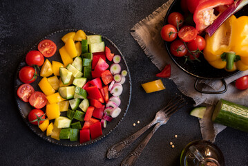 Fresh vegetables salad with tomatoes, peppers, cucumbers and other ingredients, healthy eating