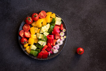 Fresh vegetables salad with tomatoes, peppers, cucumbers and other ingredients, healthy eating