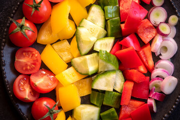 Fresh vegetables salad with tomatoes, peppers, cucumbers and other ingredients, healthy eating