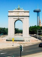 The Faro de Moncloa is a transmission tower and observation deck near the Museum of the Americas in Madrid, Spain, with the Moncloa Arch in the Foreground