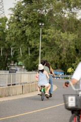 people riding bicycles, playing and exercising on vacation On the road and see the beautiful nature Thailand Dates 28-5-2022