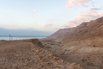 Sunrise  over the Dead Sea near mountains of stone desert near the Khatsatson stream, on the Israeli side of the Dead Sea, near Jerusalem in Israel