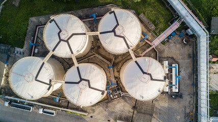 Aerial view white oil storage tank silos at industrial factory, Oil storage Fuel tank  and pipeline. © Darunrat
