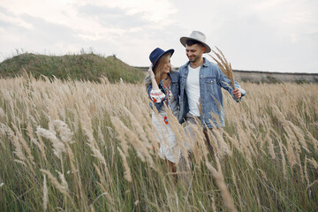 Very beautiful couple in a wheat field