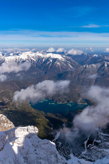 View from the Zugspitze to the surrounding mountain peaks and the Eibsee (Tyrol, Austria/ Bavaria, Germany)