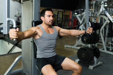 Fototapeta na wymiar Handsome muscular man exercising