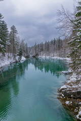deeply blue lake in the forest during winter (Bavaria, Germany
