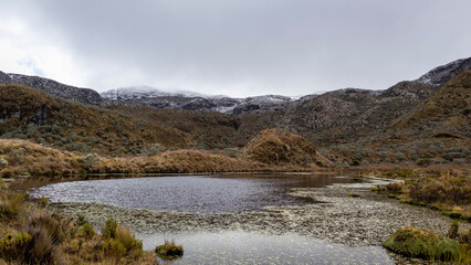 Fototapeta premium Moors, mountains, snow and lakes in the Los Nevados National Natural Park, in Manizales Caldas Colombia.
