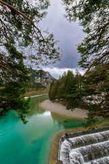 Fototapeta na wymiar deep turquoise blue river at the Lechfall in Füssen, Austria