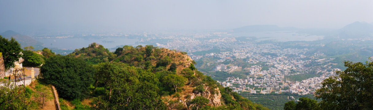 Aerial panorama of Udaipur with Lake Pichola and hills scenery. Udaipur, Rajasthan, India