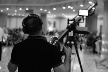 Fototapeta na wymiar Professional video technician.Videographer by event..