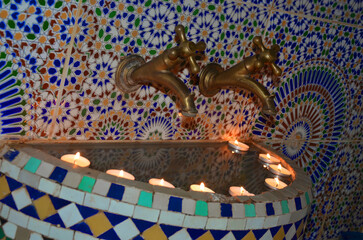 Traditional Moroccan bath with candles and traditional Moroccan tap - obrazy, fototapety, plakaty