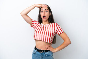 Young caucasian woman isolated on white background doing surprise gesture while looking to the side