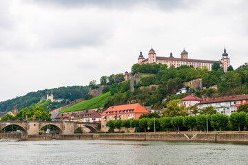 Fototapeta premium Historical built in Renaissance and Baroque styles Marienberg Fortress upon a vineyard hill above the Old Bridge and Main river seen from the other site of the river 