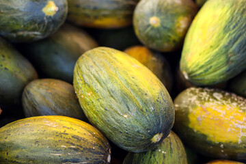 Melon background on a shelf in market. Organic eating. Farmer's food.
