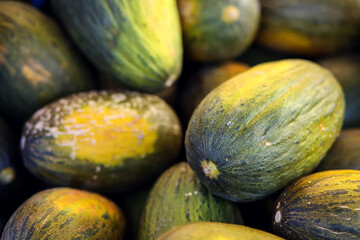 Melon background on a shelf in market. Organic eating. Farmer's food.