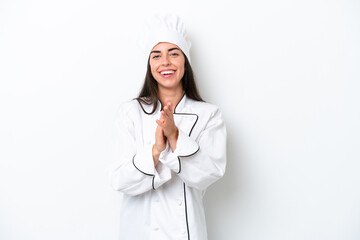 Young chef woman over white background applauding after presentation in a conference