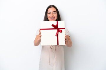 Young caucasian woman isolated on white background pregnant and holding a gift