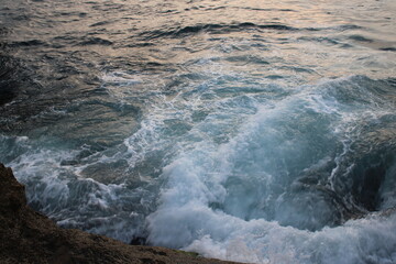 waves crashing on rocks