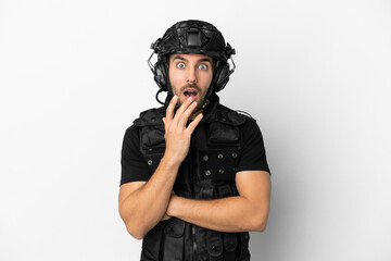Young caucasian swat isolated on white background surprised and shocked while looking right