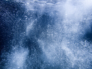 underwater blue ocean wide background with sandy sea bottom, Real natural underwater view of the Mediterranean Sea, undersea and underocean, under water empty swimming pool background with copy space.